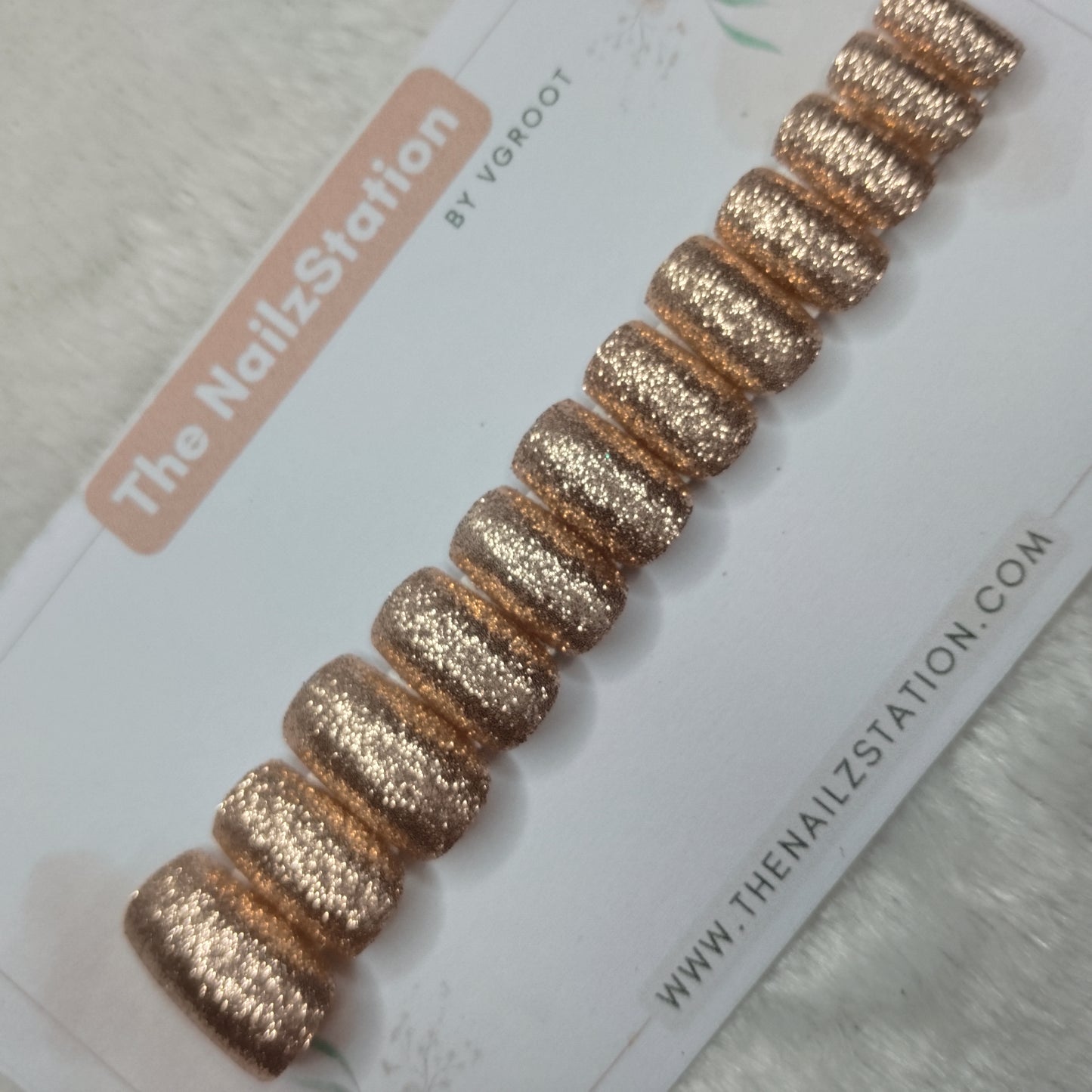 The NailzStation Glossy Golden Glitter Press on Fake Artificial Nails Set with glue, filer, sticker application kit // 1515