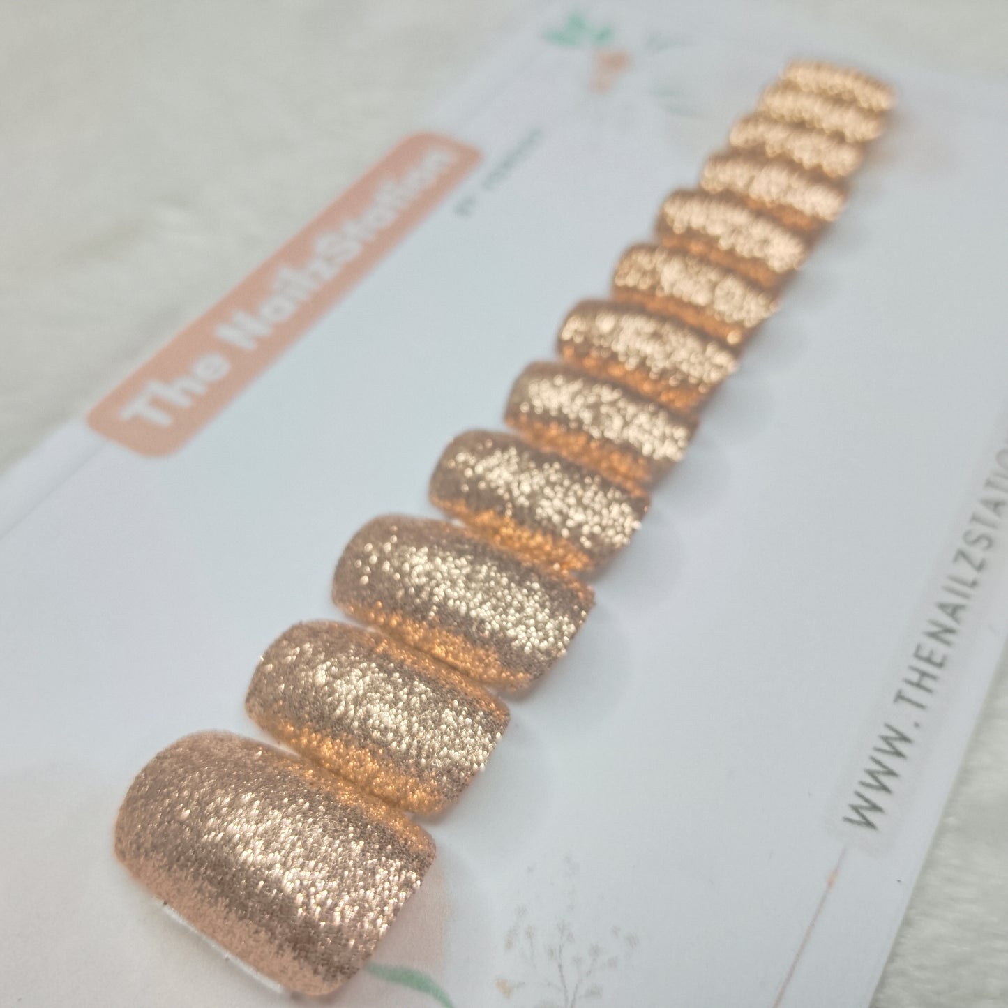 The NailzStation Glossy Golden Glitter Press on Fake Artificial Nails Set with glue, filer, sticker application kit // 1515