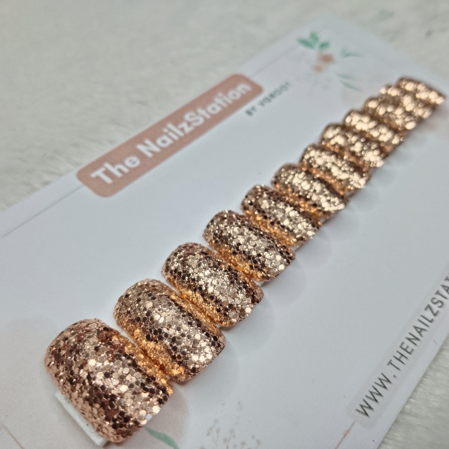 The NailzStation Glossy Golden Glitter  Press on Fake Artificial Nails Set with glue, filer, sticker application kit // 1523